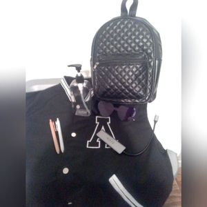 You get a Black backpack and 2 gel pens, a charging port with USB for headphones